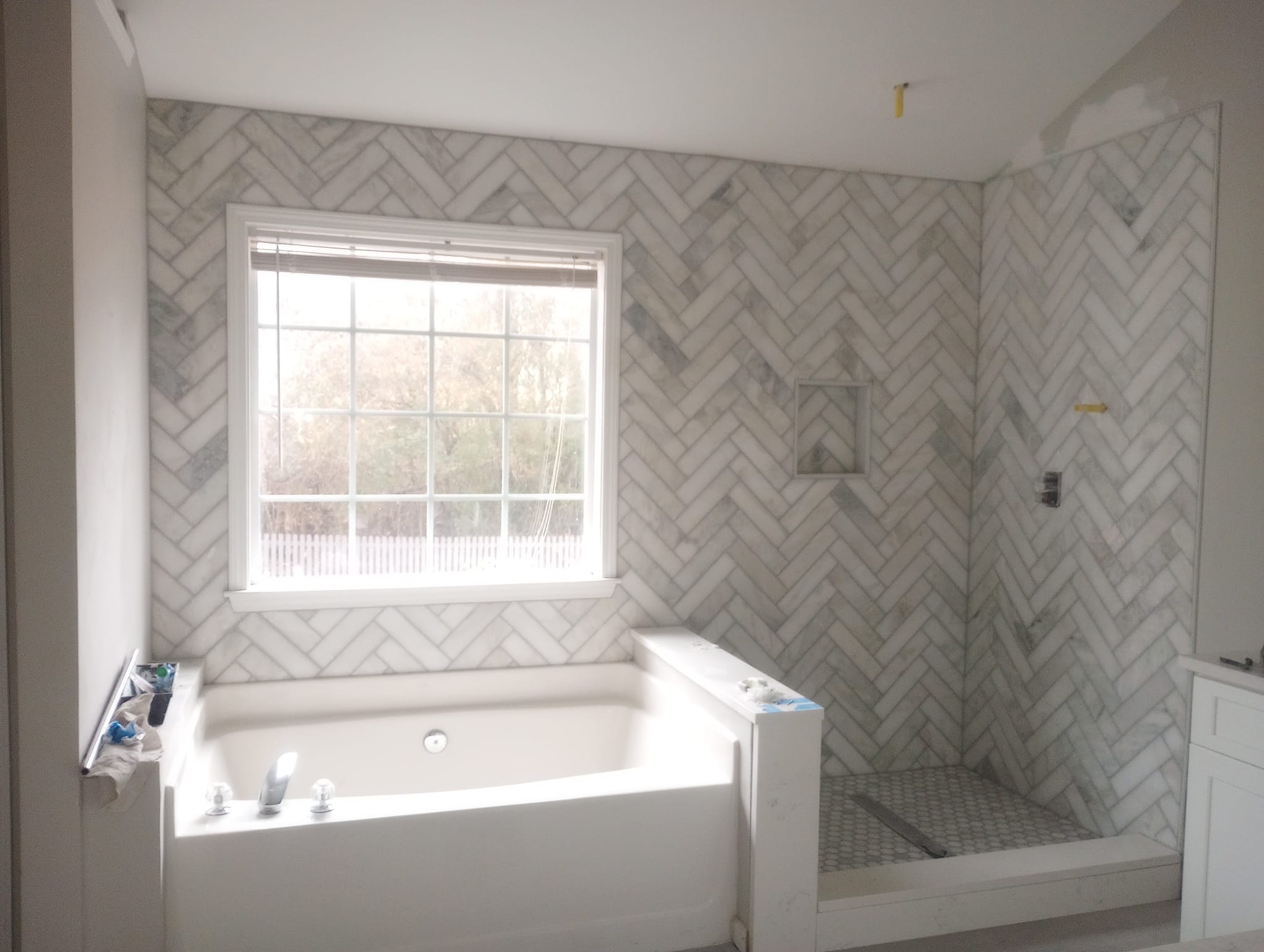 Herringbone marble tile — bathroom